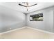 Simple bedroom boasting new flooring, neutral paint, and a ceiling fan at 1415 Helen Ave, North Las Vegas, NV 89030
