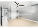 Neutral bedroom featuring closet, ceiling fan and updated flooring at 1415 Helen Ave, North Las Vegas, NV 89030