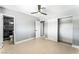 Cozy bedroom with closet, ceiling fan and access to the bathroom at 1415 Helen Ave, North Las Vegas, NV 89030