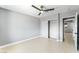 Bright bedroom with light gray walls, a ceiling fan and a closet at 1415 Helen Ave, North Las Vegas, NV 89030