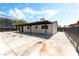 Exterior side view with carport and white gravel at 1415 Helen Ave, North Las Vegas, NV 89030