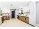 Modern kitchen featuring a combination of white and wood cabinets and light wood-look flooring at 1415 Helen Ave, North Las Vegas, NV 89030