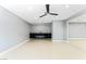 Contemporary living room boasts sleek built-in storage and an electric fireplace, ideal for relaxation and entertainment at 1415 Helen Ave, North Las Vegas, NV 89030