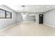 Spacious living room featuring light wood floors and modern lighting fixtures at 1415 Helen Ave, North Las Vegas, NV 89030
