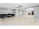 Open-concept living area with modern fireplace and adjoining kitchen, creating a seamless entertainment space at 1415 Helen Ave, North Las Vegas, NV 89030