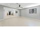 Spacious living room with open floor plan, light colored walls, and natural light, connecting seamlessly to the kitchen at 1415 Helen Ave, North Las Vegas, NV 89030