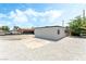 Side view of home with gravel landscaping and parking area at 1415 Helen Ave, North Las Vegas, NV 89030