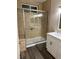 Bathroom with glass enclosed shower and white vanity at 1502 Cliff Branch Dr, Henderson, NV 89014