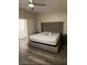 Bedroom with tufted headboard and ceiling fan at 1502 Cliff Branch Dr, Henderson, NV 89014