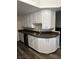 Traditional-style kitchen features white cabinets and dark countertops at 1502 Cliff Branch Dr, Henderson, NV 89014