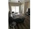 Living room features a large sectional sofa and sliding glass doors at 1502 Cliff Branch Dr, Henderson, NV 89014