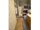 Bathroom with tile floors, wooden cabinets, framed mirror, and shower with curtain at 1511 Cardinal Peak Ln # 201, Las Vegas, NV 89144