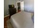 Bedroom featuring wood flooring, a plush rug, and a dark dresser with a TV at 1511 Cardinal Peak Ln # 201, Las Vegas, NV 89144