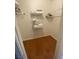 The closet has hardwood floors, white walls and shelving for storage at 1511 Cardinal Peak Ln # 201, Las Vegas, NV 89144