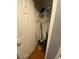 Small closet features white door, wooden floors and built-in shelving at 1511 Cardinal Peak Ln # 201, Las Vegas, NV 89144