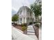 Inviting two-story townhome with neutral stucco and well-maintained landscaping and charming walkway at 1511 Cardinal Peak Ln # 201, Las Vegas, NV 89144