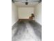 An empty one car garage with white walls is ready to be organized at 1511 Cardinal Peak Ln # 201, Las Vegas, NV 89144