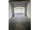 An open one car garage view looking out at a row of garages at 1511 Cardinal Peak Ln # 201, Las Vegas, NV 89144