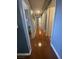 Hallway with neutral paint and wood floors at 1511 Cardinal Peak Ln # 201, Las Vegas, NV 89144
