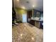 Modern kitchen features stainless steel appliances and granite countertops at 1511 Cardinal Peak Ln # 201, Las Vegas, NV 89144