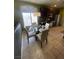 Charming eat-in kitchen featuring stainless appliances, dark cabinets, and a sunlit window at 1511 Cardinal Peak Ln # 201, Las Vegas, NV 89144