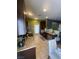 Updated kitchen featuring stainless steel appliances, granite countertops, and dark wood cabinetry at 1511 Cardinal Peak Ln # 201, Las Vegas, NV 89144