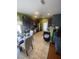 Bright eat-in kitchen with stainless appliances, dark cabinetry, tile flooring, and seamless flow to living area at 1511 Cardinal Peak Ln # 201, Las Vegas, NV 89144