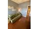 This living room has hardwood floors and light green sofa at 1511 Cardinal Peak Ln # 201, Las Vegas, NV 89144