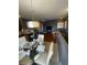 Open-concept living space features dining area and modern decor with seamless flow to the kitchen at 1511 Cardinal Peak Ln # 201, Las Vegas, NV 89144