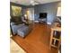 Inviting living room with modern decor, laminate flooring, and entertainment center at 1511 Cardinal Peak Ln # 201, Las Vegas, NV 89144
