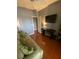 This living room has hardwood floors and gray paint tones at 1511 Cardinal Peak Ln # 201, Las Vegas, NV 89144