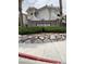Red Bluffs community sign with manicured landscaping and stone accents on a beautiful day at 1511 Cardinal Peak Ln # 201, Las Vegas, NV 89144