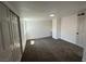 Neutral bedroom features closet, window and updated flooring at 1600 E Mcdonald Ave, North Las Vegas, NV 89030