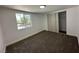 Bright bedroom with a closet, neutral paint, plush carpet, and a window providing plenty of natural light at 1600 E Mcdonald Ave, North Las Vegas, NV 89030