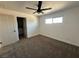 Bedroom featuring neutral paint, plush carpet, ceiling fan, and a window providing plenty of natural light at 1600 E Mcdonald Ave, North Las Vegas, NV 89030