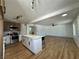 Stylish open layout featuring modern kitchen with island seating and an expansive living area at 1600 E Mcdonald Ave, North Las Vegas, NV 89030
