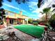 Backyard area showcases a covered patio, trampoline, and manicured space at 1628 Palmae Way, Las Vegas, NV 89128