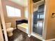 Bathroom showcasing a tiled bathtub and a separate glass-enclosed shower at 1628 Palmae Way, Las Vegas, NV 89128