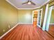 Cozy bedroom features hardwood floors and a connecting doorway at 1628 Palmae Way, Las Vegas, NV 89128