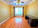Bedroom is sun-filled with lots of natural light from the large window and has a ceiling fan at 1628 Palmae Way, Las Vegas, NV 89128