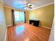Bright, open bedroom offering ample space with ceiling fan and natural light from a large window at 1628 Palmae Way, Las Vegas, NV 89128