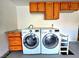 Laundry area with washer and dryer hookups, and built in cabinets at 1628 Palmae Way, Las Vegas, NV 89128
