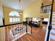 Bright living room featuring a fireplace, wood floors, and staircase to the second floor at 1628 Palmae Way, Las Vegas, NV 89128