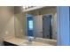 Bathroom with double sinks, expansive counter space, and a large mirror at 1777 Gentle Brook St, North Las Vegas, NV 89084