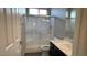 Bathroom featuring a shower with glass doors, modern fixtures, and a vanity with a sink at 1777 Gentle Brook St, North Las Vegas, NV 89084