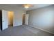 Bedroom featuring neutral walls, plush carpeting, ceiling fan, and two doorways at 1777 Gentle Brook St, North Las Vegas, NV 89084