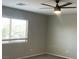 This bedroom features a ceiling fan and a window providing natural light at 1777 Gentle Brook St, North Las Vegas, NV 89084