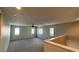 Spacious bonus room with carpet flooring, multiple windows, and a ceiling fan at 1777 Gentle Brook St, North Las Vegas, NV 89084