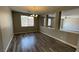 The dining room features new floors, windows for light, and a modern chandelier at 1777 Gentle Brook St, North Las Vegas, NV 89084