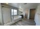 Bright bathroom with shower, tub, window and a sink with dark cabinets at 1777 Gentle Brook St, North Las Vegas, NV 89084